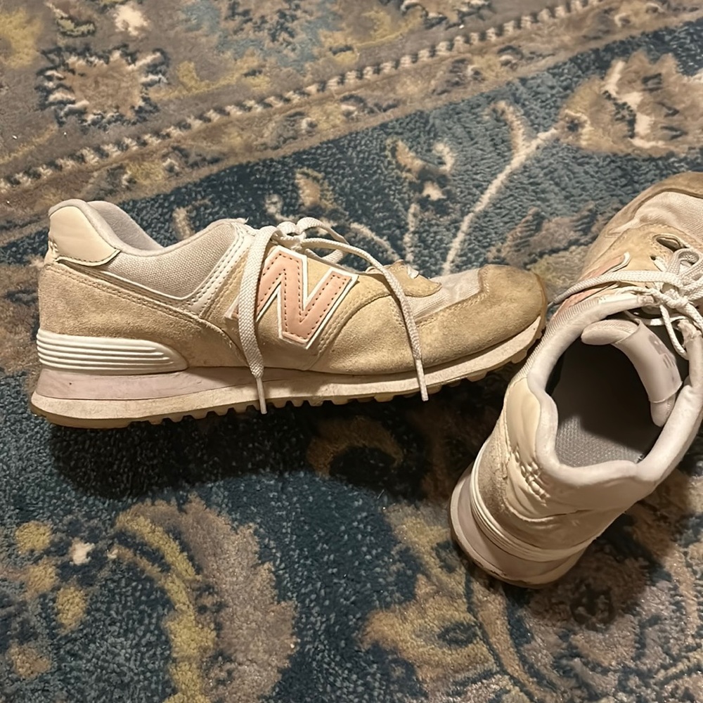 Used light pink suede New Balance 574 sneakers
